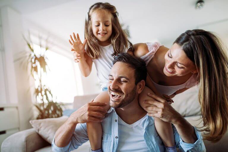 Happy family in their insulated Perth home